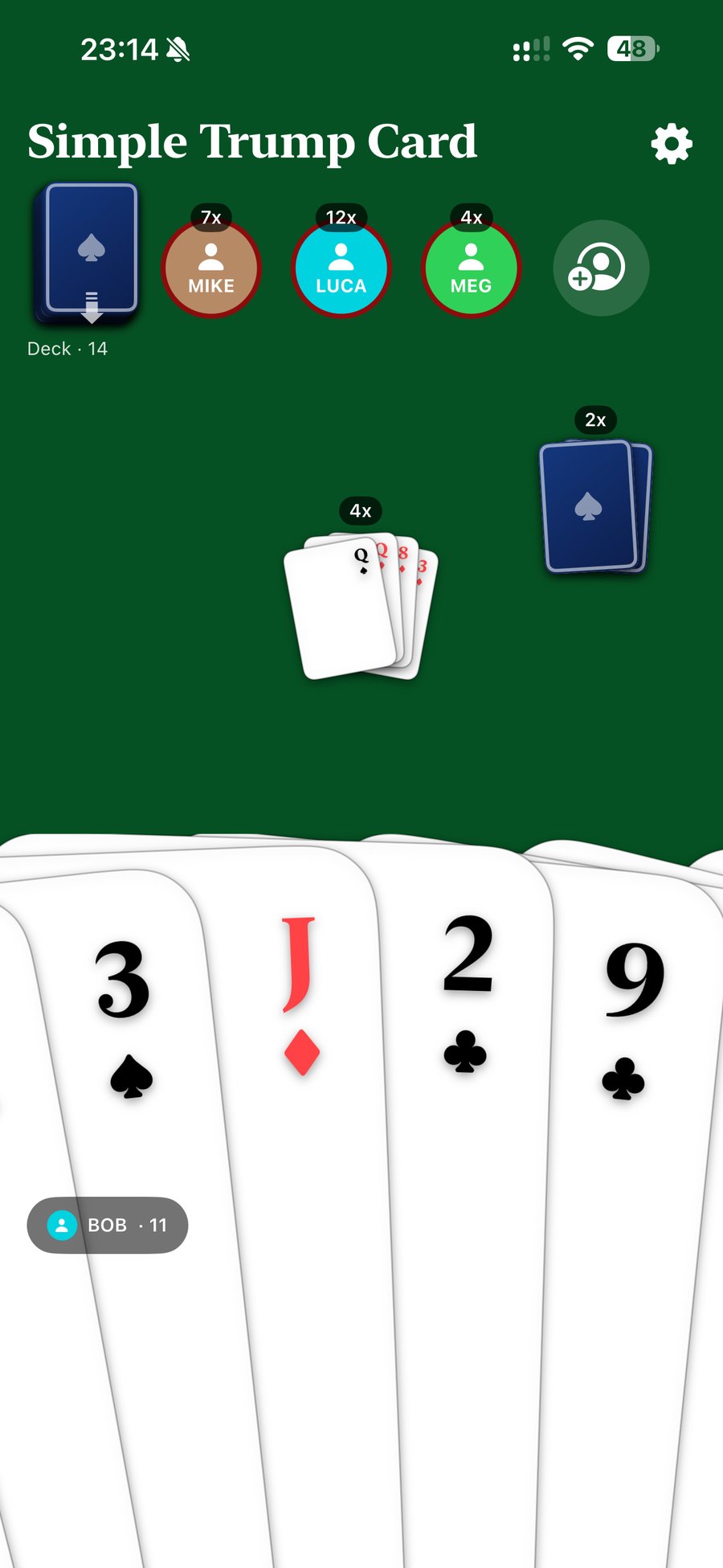 A player's hand fanned out with several cards, and two face-down piles on the table