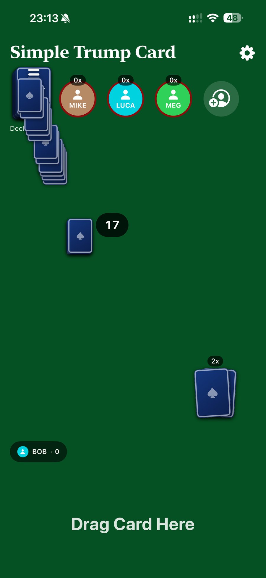 The table with a shuffled deck, four connected players' avatars, and a face-down pile mid-draw